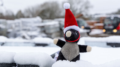 Drainfast yard in the snow with Christmas mole mascot
