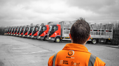 A Drainfast worker looks over the fleet of delivery vehicles.