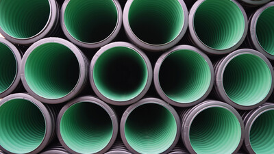 Black twin-wall storm-water drainage pipe with green inside