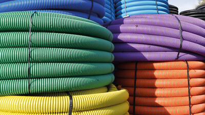 Brightly coloured underground ducting pipe coils