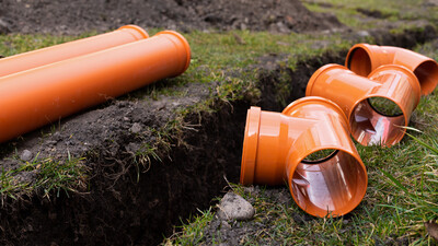 plastic drainage pipe installation grass uk