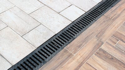 Linear drainage channel in a paved area
