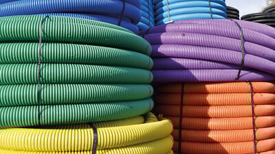 Brightly coloured underground ducting pipe coils