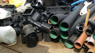 Messy building site pile of pipes