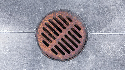old rusty drain gully