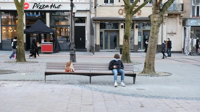 public square UK with bench and retail stores in the background