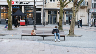 public square UK with bench and retail stores in the background