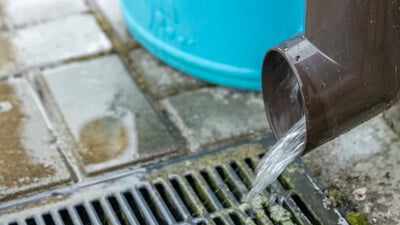 gutter draining into a gully to fill a soakaway
