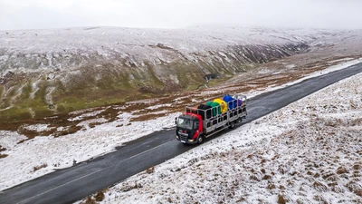 Drainfast Delivery Truck Driving along the Buttertubs Pass in the Yorkshire Dales in the snow