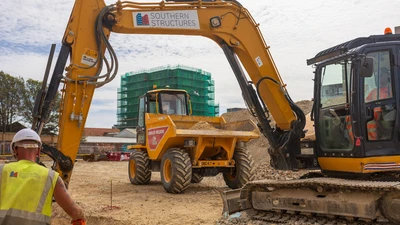 Construction Project In Brighton with Southern Structures equipment and workers excavating a trench 