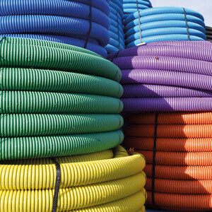 Brightly coloured underground ducting pipe coils