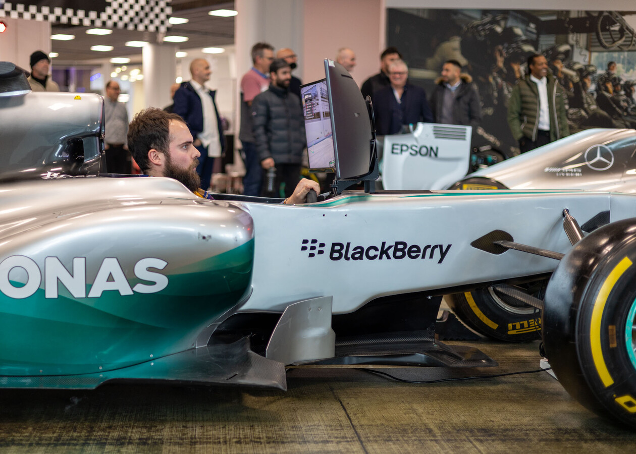 Drainfast team racing on The Grid at Mercedes-Benz World